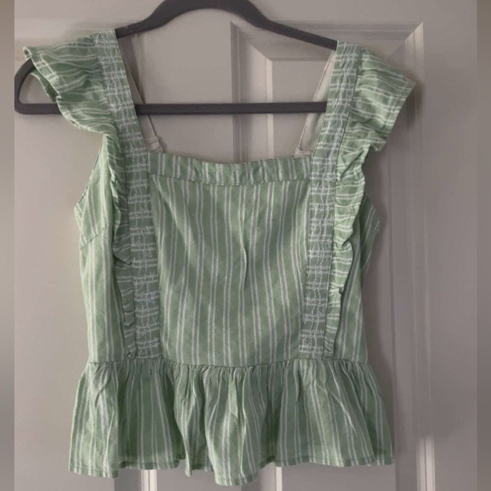 size small green top; kinda cropped, definitely appropriate for things like work